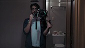 Followed horror movie Matthew Solomon holding his camera rig.